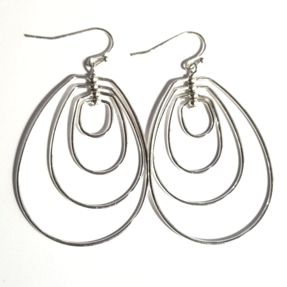 Silver tone earrings dangly hoops